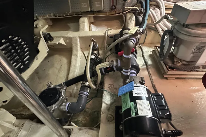 Slide: The Image of Engine room of 2006 Novatec Islander 55 yacht, showcasing mechanical components and piping. - 100