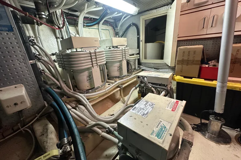 Slide: The Image of Engine room of 2006 Novatec Islander 55 yacht with machinery and cables. - 105