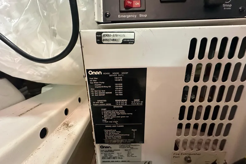 Slide: The Image of Onan generator panel in a 2006 Novatec Islander 55 yacht engine room. - 108
