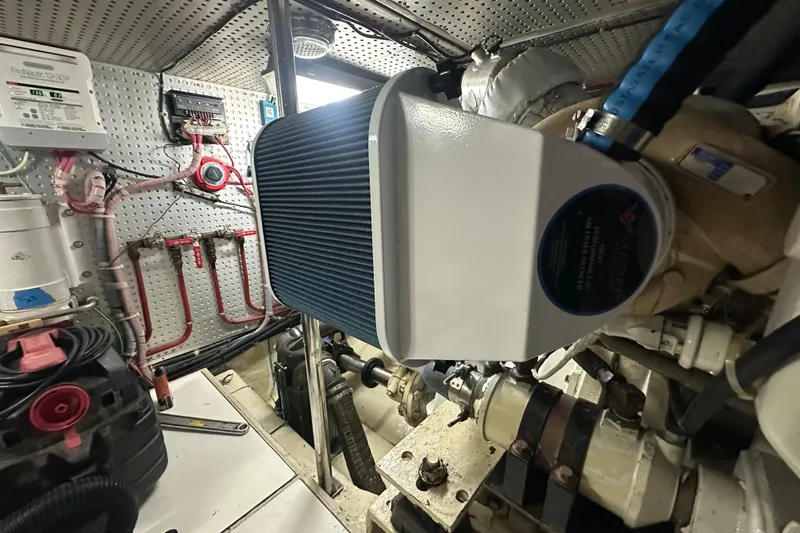 Slide: The Image of Engine room of 2006 Novatec Islander 55 yacht, featuring mechanical components and wiring. - 109