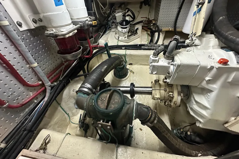 Slide: The Image of Engine room of 2006 Novatec Islander 55 yacht, showcasing mechanical components and piping. - 111