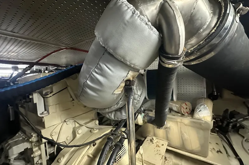 Slide: The Image of Engine room of 2006 Novatec Islander 55 yacht, showcasing insulated components and piping. - 115