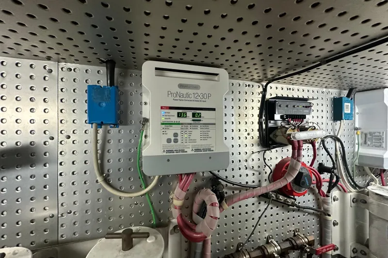 Slide: The Image of Electrical panel on a 2006 Novatec Islander 55 yacht, featuring ProNautic 1230P charger. - 116