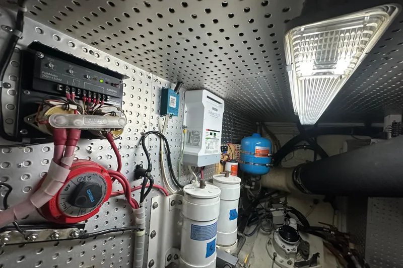 Slide: The Image of Engine room of 2006 Novatec Islander 55 yacht with electrical components and filters. - 117