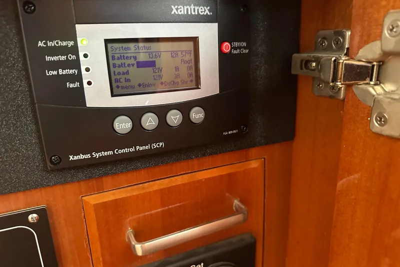 Slide: The Image of Xantrex control panel on 2006 Novatec Islander 55 yacht, displaying system status. - 118