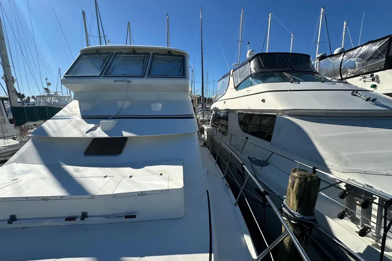 Slide: The Image of 2006 Novatec Islander 55 yacht docked at marina under clear blue sky. - 15
