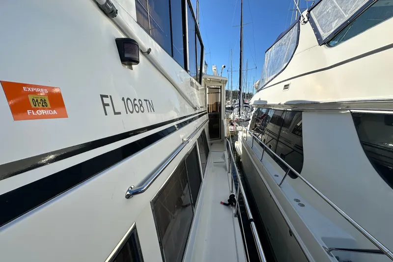 Slide: The Image of 2006 Novatec Islander 55 yacht docked, side view with Florida registration. - 18
