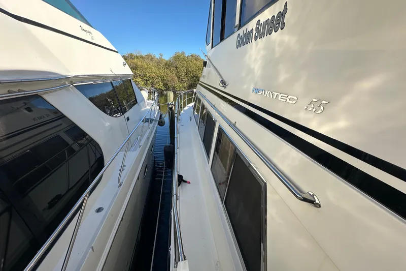 Slide: The Image of Novatec Islander 55 yacht, 2006 model, docked beside another vessel. - 22