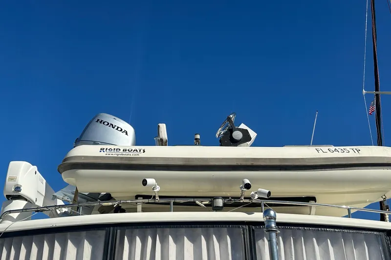 Slide: The Image of Novatec Islander 55 yacht with Rigid Boats tender and Honda motor, 2006 model. - 23