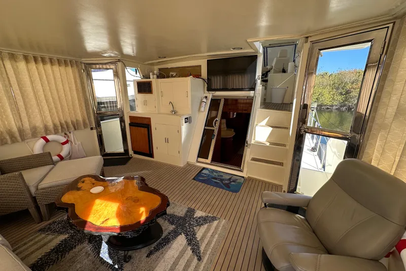 Slide: The Image of Luxurious 2006 Novatec Islander 55 yacht interior with elegant seating and wooden table. - 24