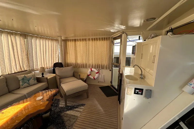 Slide: The Image of Luxurious interior of 2006 Novatec Islander 55 yacht with cozy seating and elegant decor. - 27