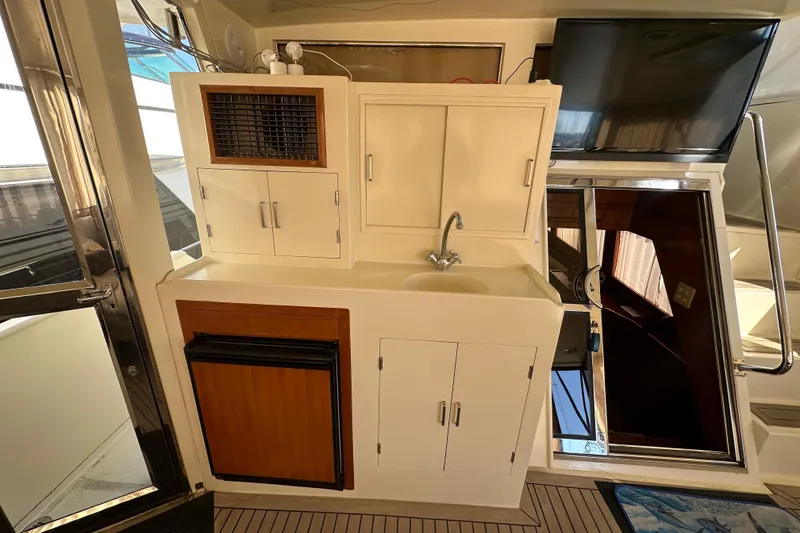 Slide: The Image of 2006 Novatec Islander 55 yacht interior with kitchenette, sink, and storage cabinets. - 30