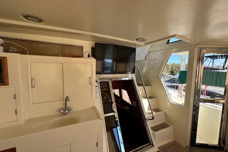 Slide: The Image of Interior of 2006 Novatec Islander 55 yacht with sink, TV, and stairs. - 31