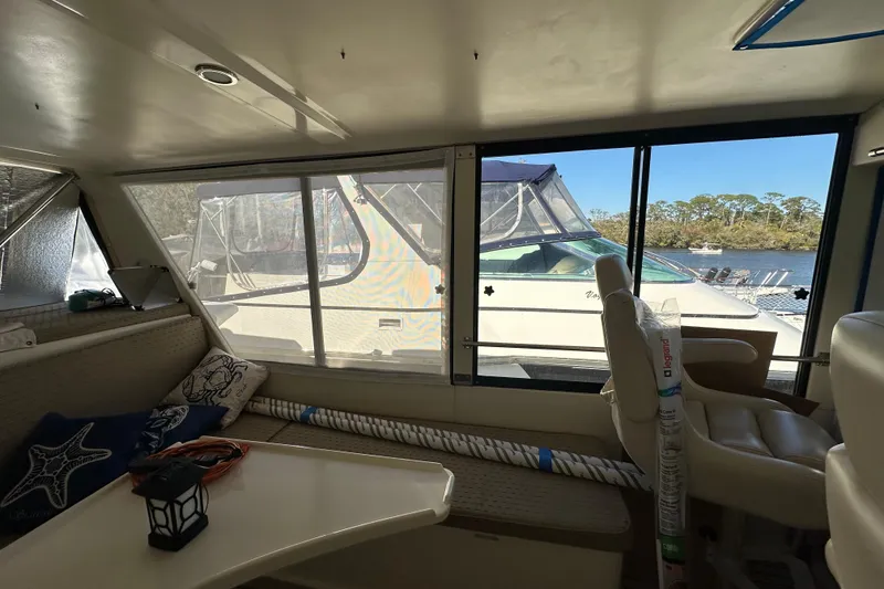 Slide: The Image of Interior view of 2006 Novatec Islander 55 yacht with seating and window view. - 36