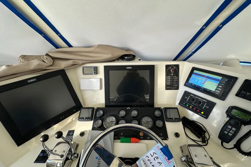Slide: The Image of Cockpit of 2006 Novatec Islander 55 yacht with navigation and control panels. - 41