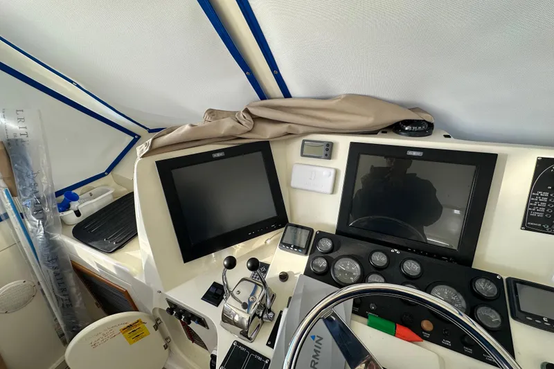Slide: The Image of Helm of 2006 Novatec Islander 55 yacht with dual screens and navigation controls. - 42