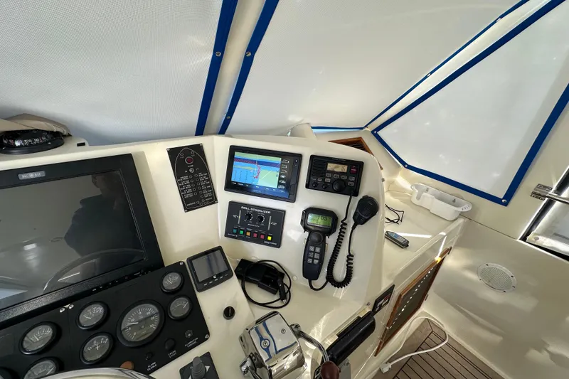 Slide: The Image of Cockpit of 2006 Novatec Islander 55 yacht with navigation instruments and controls. - 43