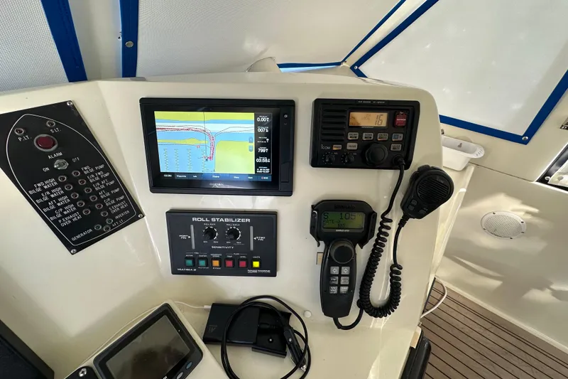 Slide: The Image of Control panel of a 2006 Novatec Islander 55 yacht with navigation and communication equipment. - 44