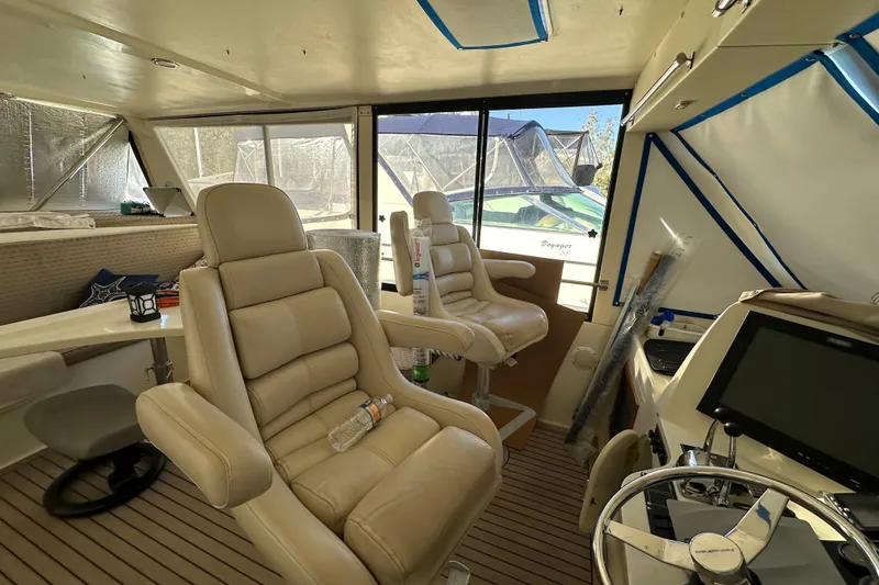 Slide: The Image of Interior of 2006 Novatec Islander 55 yacht with beige seating and navigation equipment. - 46