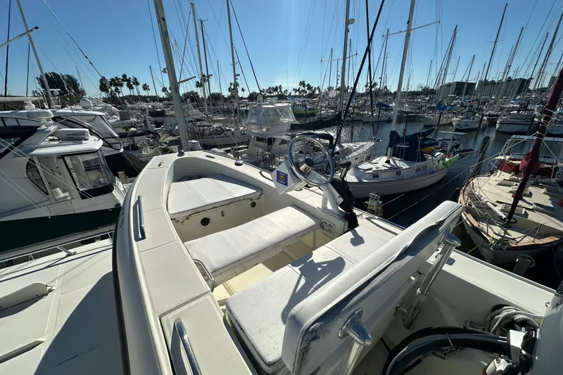 Slide: The Image of Novatec Islander 55 yacht, 2006 model, docked in a marina with other boats. - 49