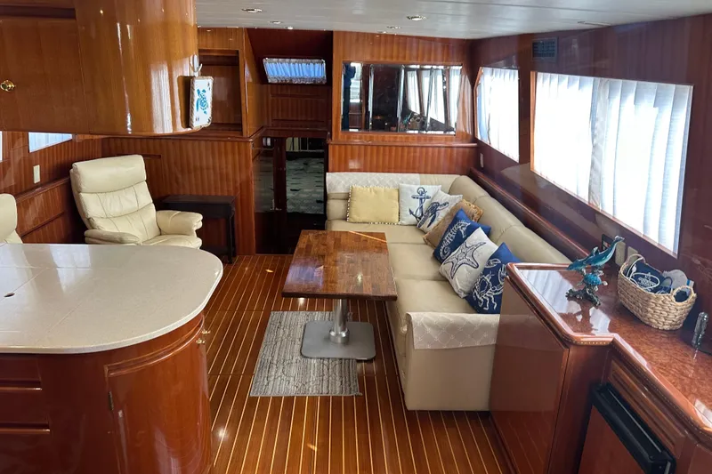 Slide: The Image of Luxurious interior of 2006 Novatec Islander 55 yacht with elegant wood finishes and plush seating. - 55