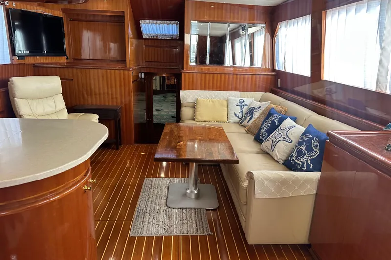 Slide: The Image of Luxurious interior of 2006 Novatec Islander 55 yacht with elegant wood finishes and cozy seating. - 56
