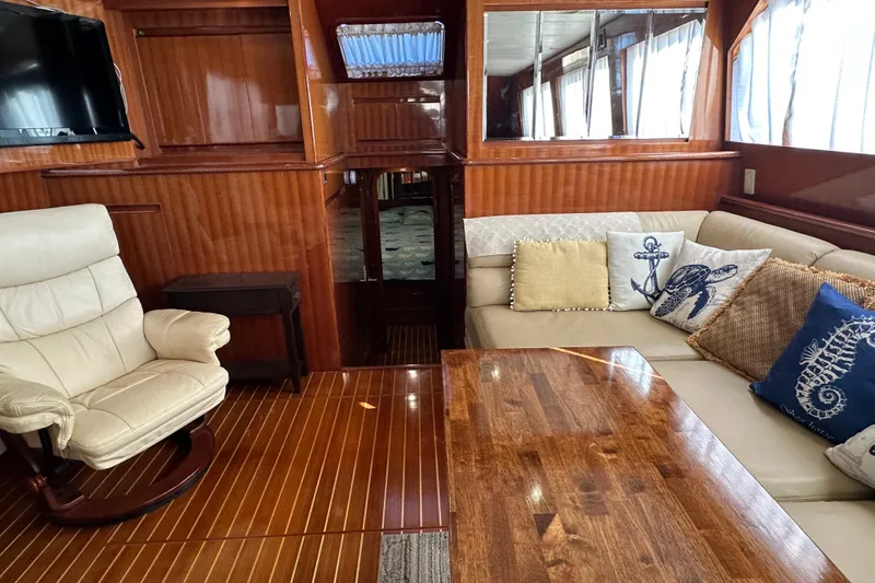 Slide: The Image of Luxurious 2006 Novatec Islander 55 yacht interior with elegant wood finish and cozy seating. - 58