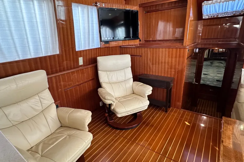Slide: The Image of Luxurious interior of 2006 Novatec Islander 55 yacht with leather chairs and wood paneling. - 59