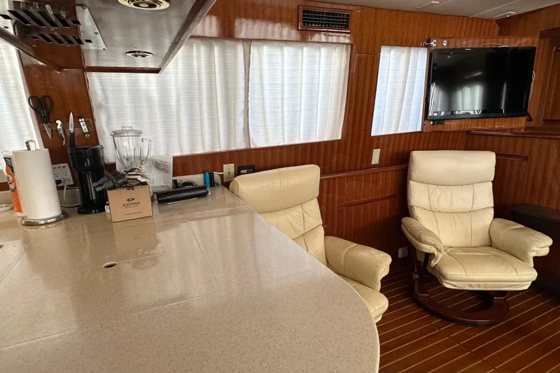 Slide: The Image of Luxurious interior of 2006 Novatec Islander 55 yacht with leather chairs and modern amenities. - 60