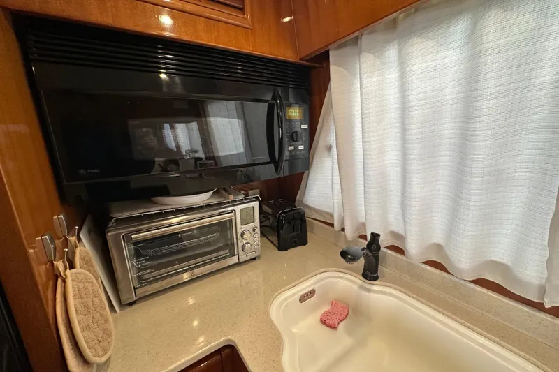 Slide: The Image of Galley kitchen in 2006 Novatec Islander 55 yacht with microwave and toaster oven. - 66