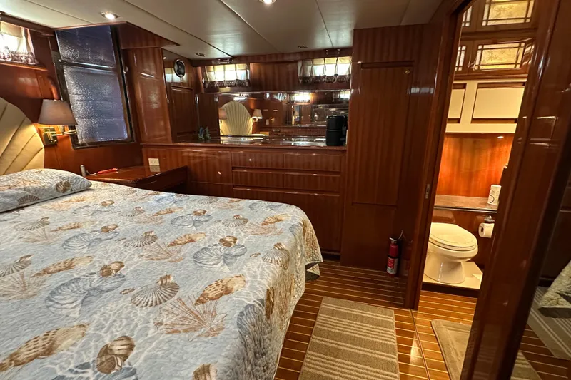 Slide: The Image of Luxurious 2006 Novatec Islander 55 yacht bedroom with elegant wood finish and ensuite bathroom. - 72
