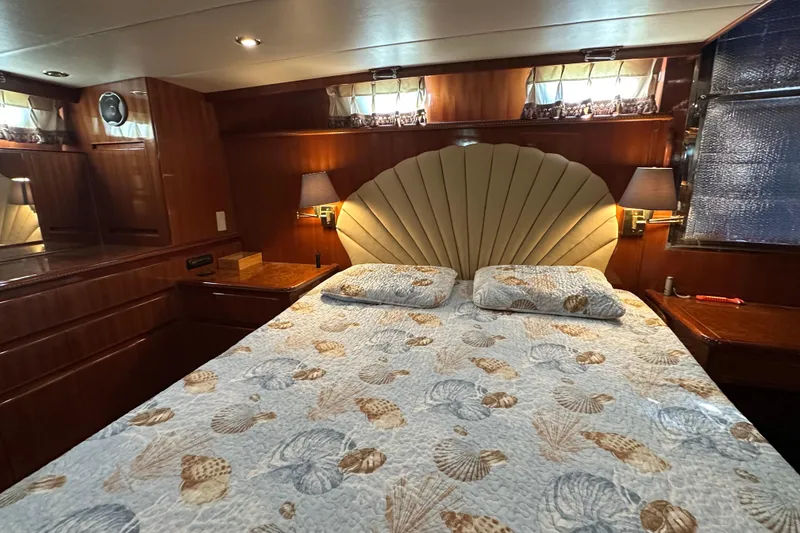 Slide: The Image of Luxurious bedroom interior of 2006 Novatec Islander 55 yacht with elegant bedding and wood paneling. - 75