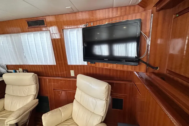 Slide: The Image of Luxurious interior of 2006 Novatec Islander 55 yacht with TV and leather chairs. - 82