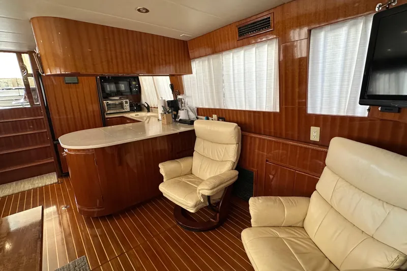 Slide: The Image of Luxurious interior of 2006 Novatec Islander 55 yacht with leather chairs and wooden finishes. - 83