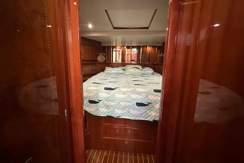 Slide: The Image of Luxurious bedroom interior of 2006 Novatec Islander 55 yacht with whale-patterned bedding. - 89