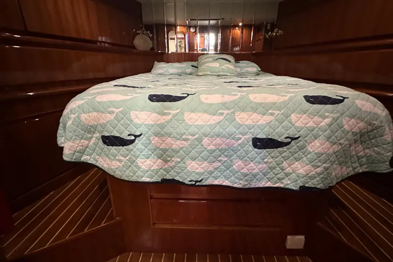 Slide: The Image of Luxurious cabin interior of 2006 Novatec Islander 55 yacht with whale-patterned bedding. - 90