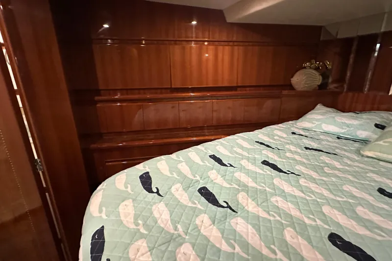 Slide: The Image of Luxurious bedroom interior of 2006 Novatec Islander 55 yacht with whale-patterned bedding. - 92