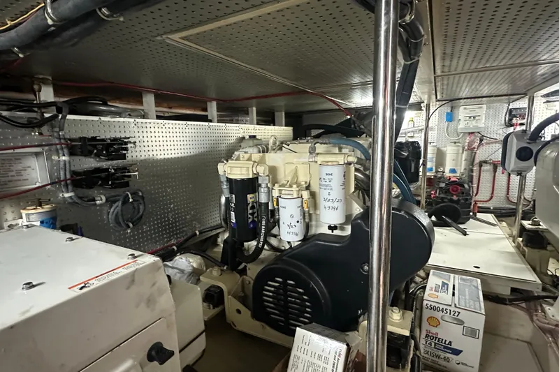 Slide: The Image of Engine room of 2006 Novatec Islander 55 yacht, showcasing mechanical components and equipment. - 98