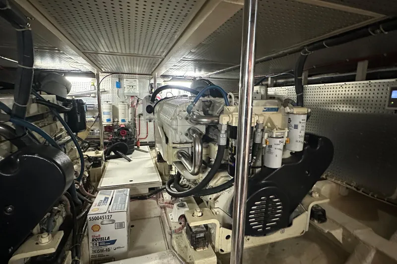 Slide: The Image of Engine room of 2006 Novatec Islander 55 yacht, featuring mechanical components and equipment. - 99