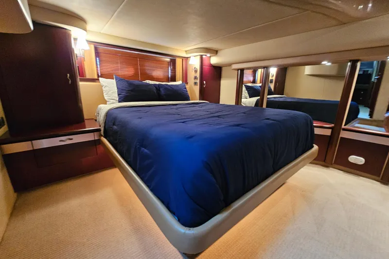 Slide: The Image of Luxurious bedroom interior of 2006 Sea Ray 580 Sedan Bridge yacht. - 25