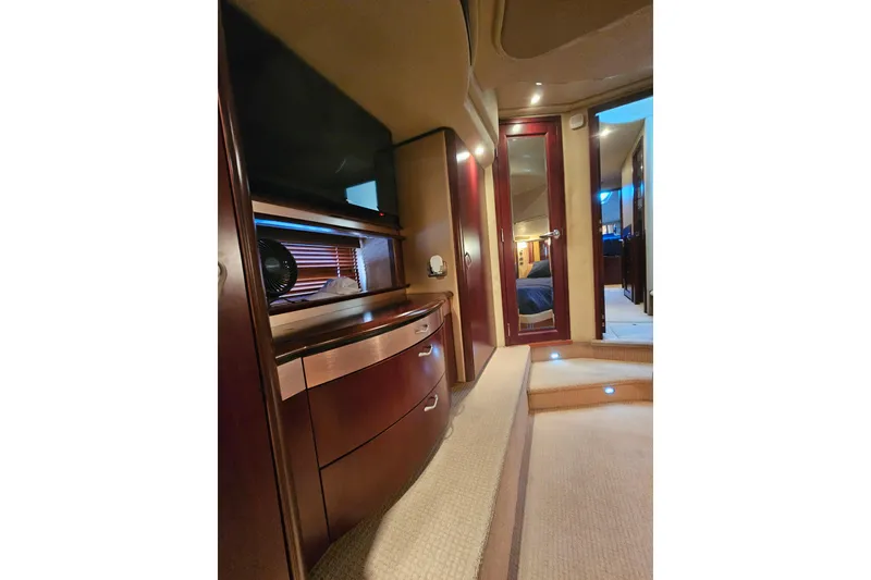 Slide: The Image of Luxurious interior of 2006 Sea Ray 580 Sedan Bridge yacht with elegant wood cabinetry. - 29