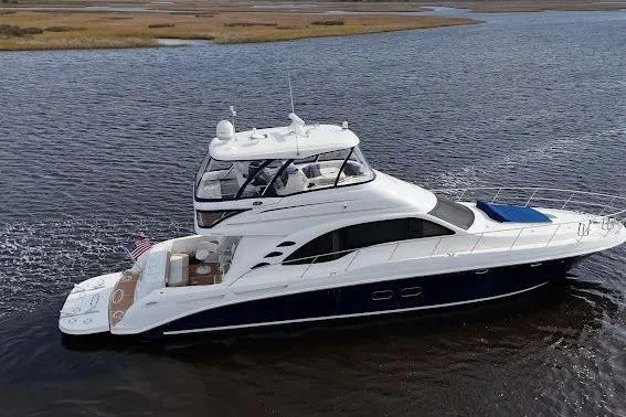 Slide: The Image of 2006 Sea Ray 580 Sedan Bridge yacht cruising on open water. - 5
