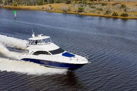 Slide: The Image of 2006 Sea Ray 580 Sedan Bridge cruising on a calm river. - 6