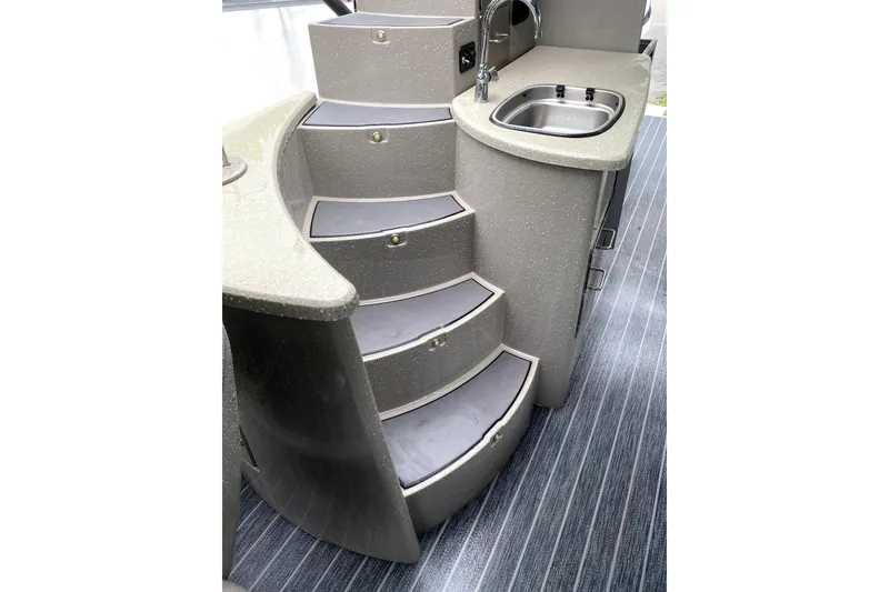 Slide: The Image of JL Audio MediaMaster 105 interface in 2022 Premier Escalante, displaying FM radio selection. - 12