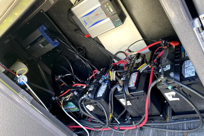 Slide: The Image of Luxurious seating area on a 2022 Premier Escalante boat with a central table. - 18