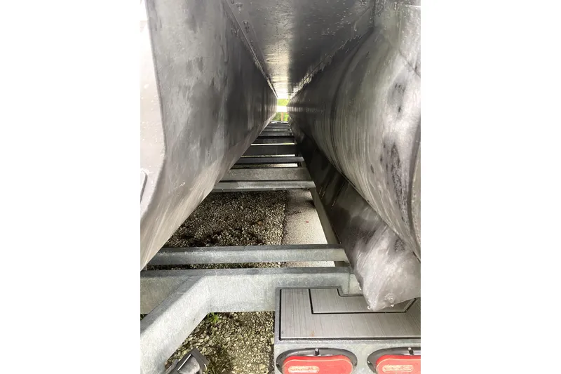 Slide: The Image of 2022 Premier Escalante boat dashboard with Simrad display and steering wheel. - 19