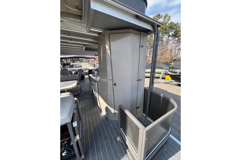 Slide: The Image of 2022 Premier Escalante boat interior with seating and storage compartments. - 34