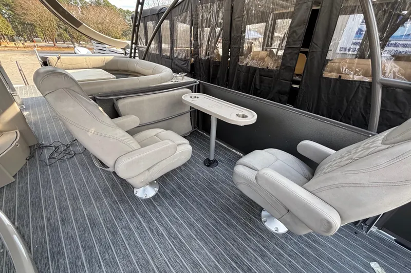 Slide: The Image of Interior of 2022 Premier Escalante boat with plush seating and table. - 35