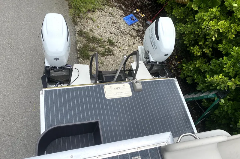 Slide: The Image of 2022 Premier Escalante boat propeller on asphalt, near trailer and ropes. - 7