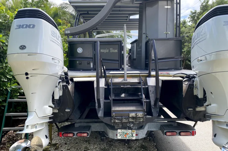 Slide: The Image of 2022 Premier Escalante boat deck with striped flooring and storage compartments. - 9